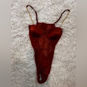 sexy orange one piece from fashion nova